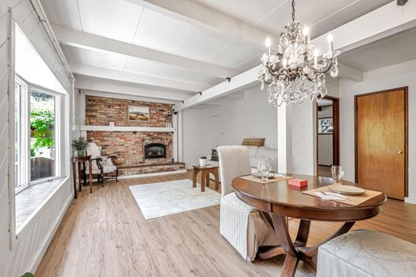 Chandelier, Dining room, Fireplace, Interior, Living room, Stone Walls, Wood Texture Flooring