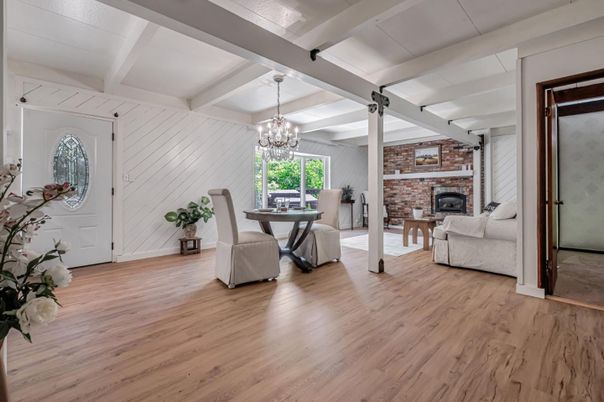 Chandelier, Dining room, Fireplace, Interior, Living room, Stone Walls, Wood Texture Flooring