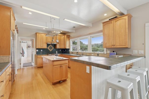 Chandelier, Interior, Kitchen, Pendant Lights, Recessed Lighting, Tile Countertops, Wood Texture Flooring