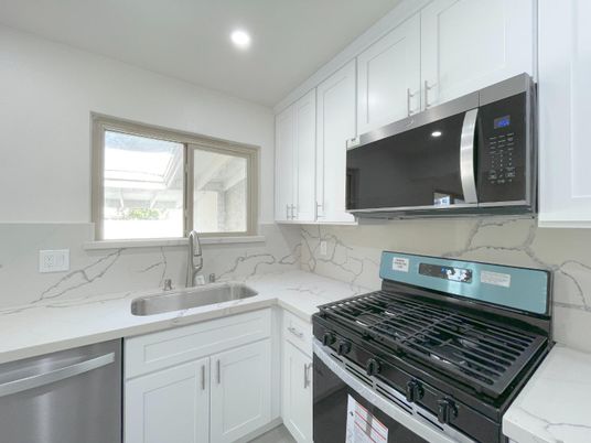 Interior, Kitchen, Marble Walls, Recessed Lighting, Stainless Steel Appliances
