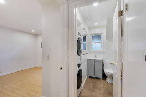 Bathroom, Interior, Recessed Lighting, Washer, Wood Texture Flooring