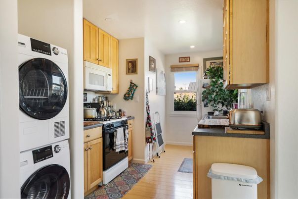 Interior, Kitchen, Recessed Lighting, Washer, Wood Texture Flooring