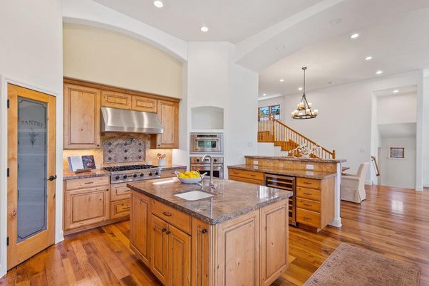 Chandelier, Interior, Kitchen, Pendant Lights, Recessed Lighting, Stainless Steel Appliances, Wood Texture Flooring