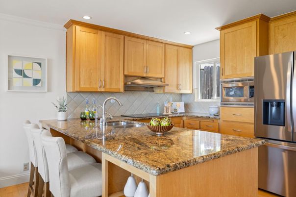 Dining room, Fireplace, Interior, Kitchen, Recessed Lighting, Stainless Steel Appliances, Stone Walls, Wood Texture Flooring