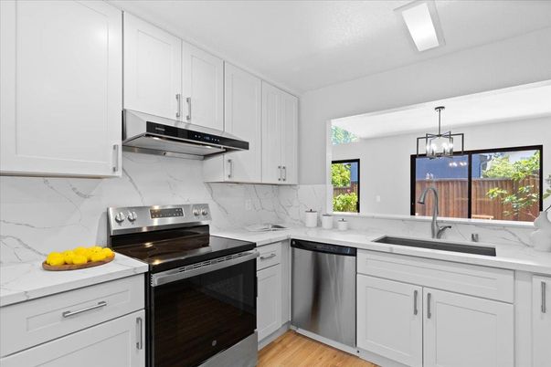 Interior, Kitchen, Marble Walls, Pendant Lights, Stainless Steel Appliances, Wood Texture Flooring
