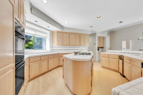 Interior, Kitchen, Recessed Lighting, Tile Countertops, Wood Texture Flooring