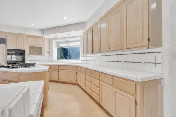 Interior, Kitchen, Recessed Lighting, Tile Countertops, Wood Texture Flooring
