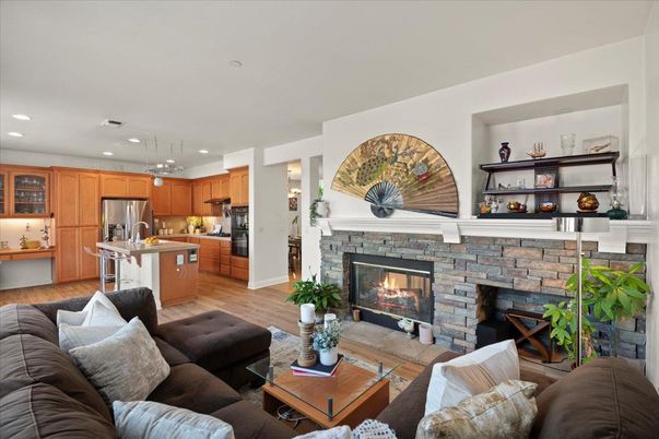 Fireplace, Interior, Kitchen, Living room, Pendant Lights, Recessed Lighting, Stainless Steel Appliances, Wood Texture Flooring