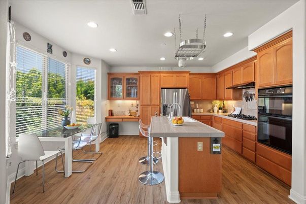 Dining room, Interior, Kitchen, Recessed Lighting, Stainless Steel Appliances, Wood Texture Flooring