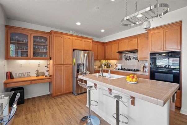 Interior, Kitchen, Recessed Lighting, Stainless Steel Appliances, Tile Countertops, Wood Texture Flooring