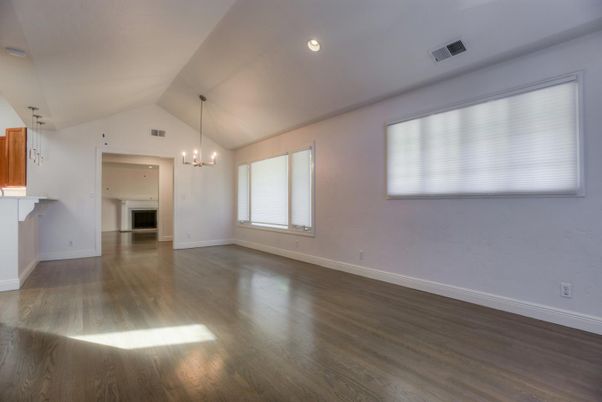 Chandelier, Empty room, Fireplace, Interior, Pendant Lights, Recessed Lighting, Wood Texture Flooring