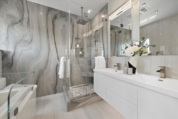 Bathroom, Dual Sink Vanities, Glass Shower, Interior, Marble Walls, Recessed Lighting, Wood Texture Flooring