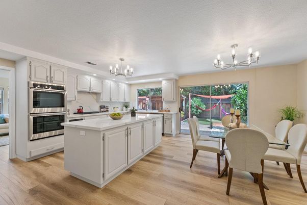 Chandelier, Dining room, Interior, Kitchen, Stainless Steel Appliances, Wood Texture Flooring