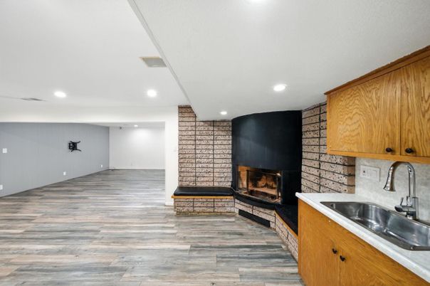 Fireplace, Interior, Kitchen, Recessed Lighting, Wood Texture Flooring