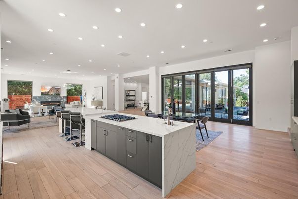 Dining room, Fireplace, Interior, Kitchen, Living room, Recessed Lighting, Stainless Steel Appliances, Wood Texture Flooring