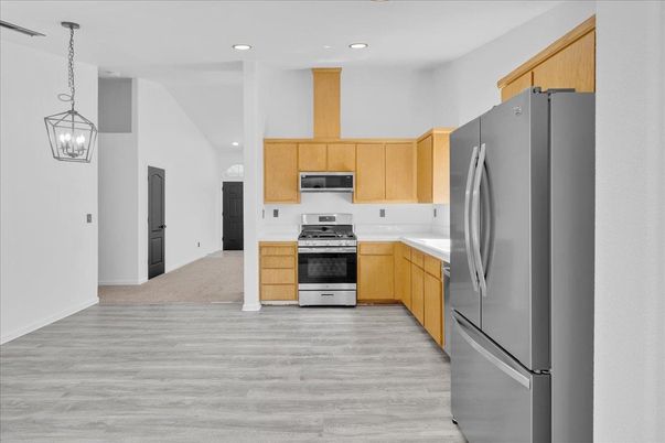 Interior, Kitchen, Pendant Lights, Recessed Lighting, Stainless Steel Appliances, Wood Texture Flooring