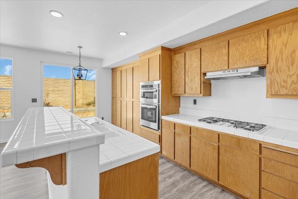 Interior, Kitchen, Pendant Lights, Recessed Lighting, Tile Countertops, Wood Texture Flooring