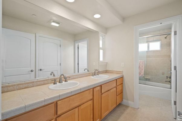 Bathroom, Dual Sink Vanities, Glass Shower, Interior, Recessed Lighting, Tile Countertops