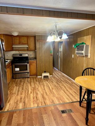 Chandelier, Interior, Kitchen, Stainless Steel Appliances, Wood Texture Flooring, Wooden Walls