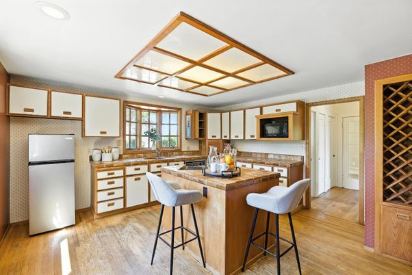 Interior, Kitchen, Recessed Lighting, Tile Countertops, Wood Texture Flooring