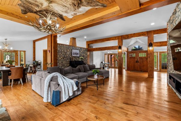 Chandelier, Dining room, Interior, Living room, Recessed Lighting, Stone Walls, Wooden Beams, Wood Texture Flooring