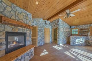 Empty room, Fireplace, Interior, Recessed Lighting, Stone Walls, Wooden Beams, Wooden Ceilings