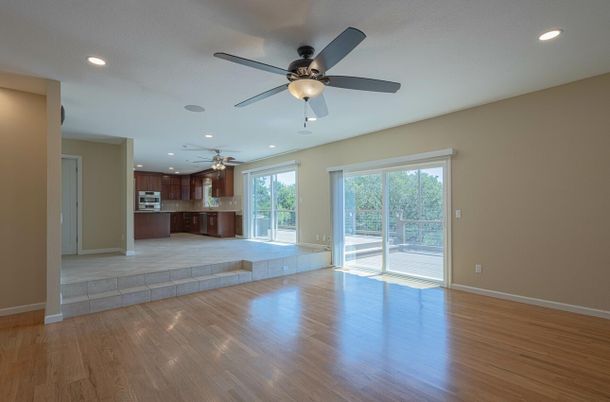 Empty room, Interior, Kitchen, Recessed Lighting, Stainless Steel Appliances, Wood Texture Flooring