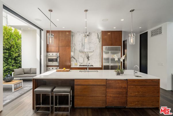 Interior, Kitchen, Marble Walls, Pendant Lights, Recessed Lighting, Stainless Steel Appliances, Wood Texture Flooring