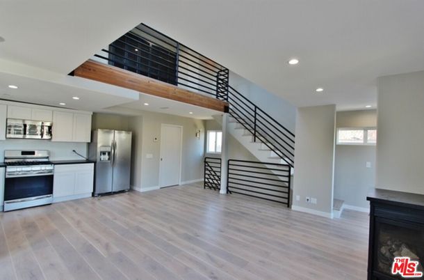 Fireplace, Interior, Kitchen, Recessed Lighting, Stainless Steel Appliances, Wood Texture Flooring