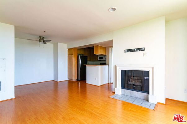 Empty room, Fireplace, Interior, Kitchen, Recessed Lighting, Wood Texture Flooring