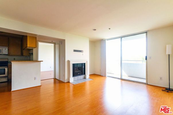 Empty room, Fireplace, Interior, Kitchen, Recessed Lighting, Wood Texture Flooring