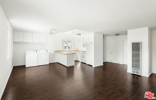 Interior, Kitchen, Recessed Lighting, Washer, Wood Texture Flooring