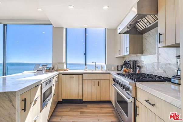 Interior, Kitchen, Marble Walls, Recessed Lighting, Stainless Steel Appliances, Water, Wood Texture Flooring