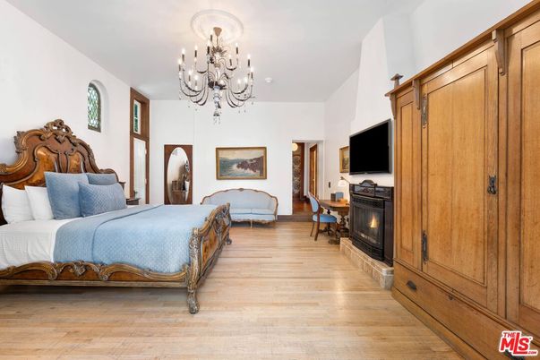 Bedroom, Chandelier, Fireplace, Interior, Wood Texture Flooring