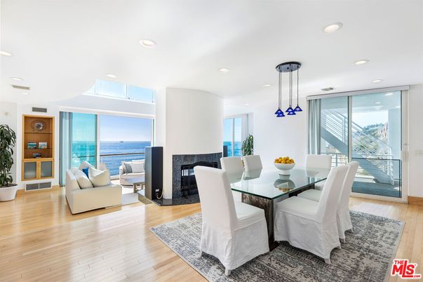 Dining room, Fireplace, Interior, Living room, Pendant Lights, Recessed Lighting, Water, Wood Texture Flooring