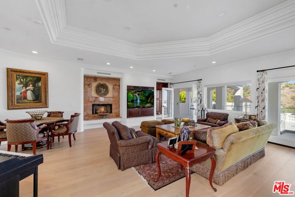 Dining room, Fireplace, Interior, Living room, Recessed Lighting, Wood Texture Flooring