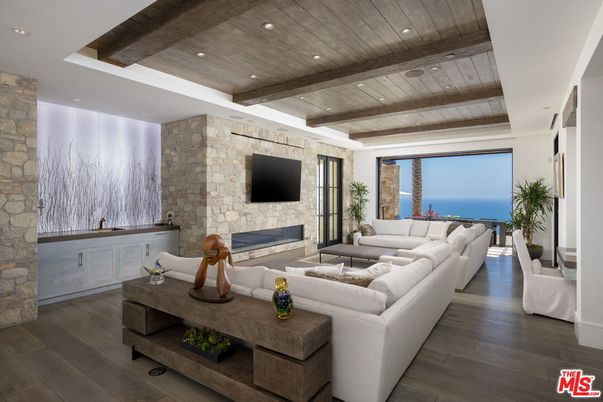Fireplace, Interior, Living room, Recessed Lighting, Stone Walls, Water, Wooden Beams, Wooden Ceilings, Wood Texture Flooring