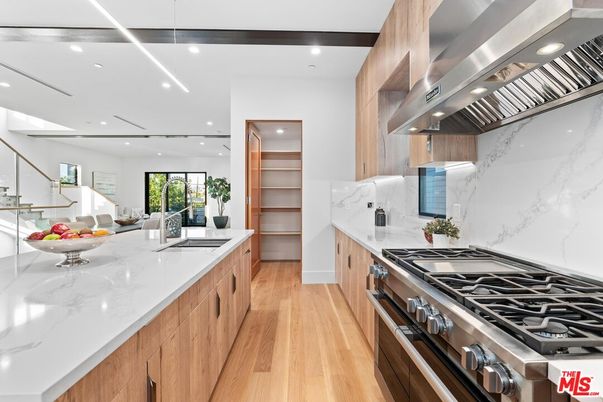Interior, Kitchen, Marble Walls, Recessed Lighting, Stainless Steel Appliances, Wood Texture Flooring