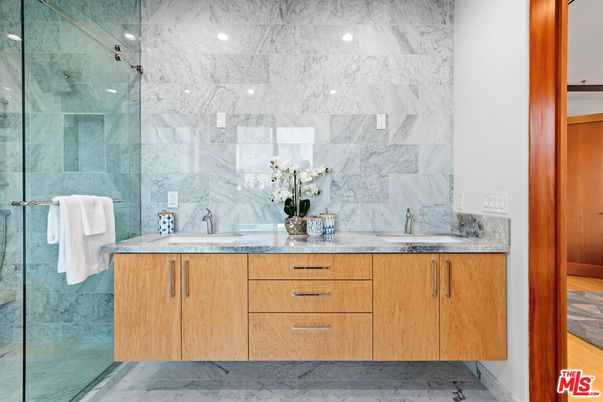 Bathroom, Dual Sink Vanities, Glass Shower, Interior, Marble, Marble Walls, Recessed Lighting
