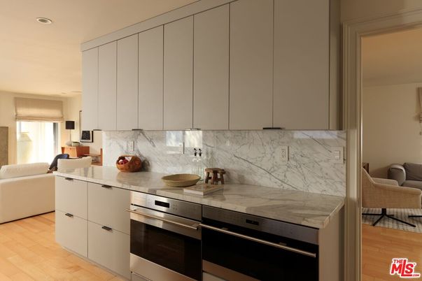 Interior, Kitchen, Marble Walls, Recessed Lighting, Stainless Steel Appliances, Wood Texture Flooring