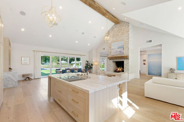 Chandelier, Fireplace, Interior, Kitchen, Living room, Pendant Lights, Recessed Lighting, Wooden Beams, Wood Texture Flooring