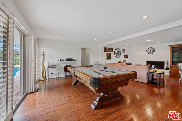 Billiard Table, Fireplace, Game Room, Interior, Living room, Recessed Lighting, Wood Texture Flooring