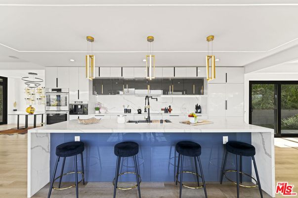 Interior, Kitchen, Marble Walls, Pendant Lights, Recessed Lighting, Stainless Steel Appliances, Wood Texture Flooring