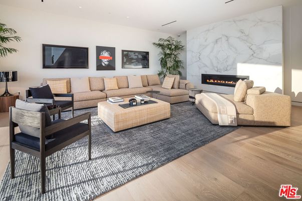 Fireplace, Interior, Living room, Marble Walls, Recessed Lighting, Wood Texture Flooring