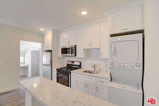 Interior, Kitchen, Recessed Lighting, Washer, Wood Texture Flooring