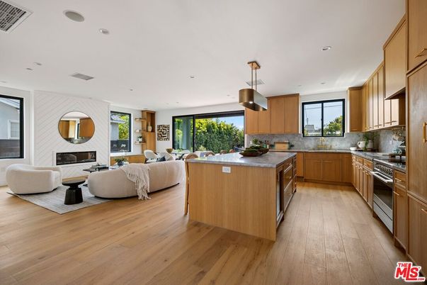 Fireplace, Interior, Kitchen, Living room, Pendant Lights, Recessed Lighting, Stainless Steel Appliances, Wood Texture Flooring