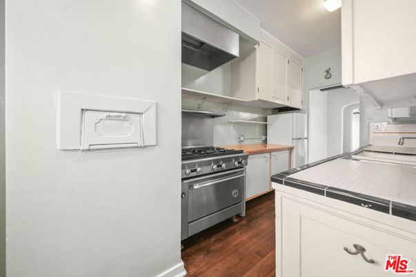 Interior, Kitchen, Stainless Steel Appliances, Tile Countertops, Wood Texture Flooring