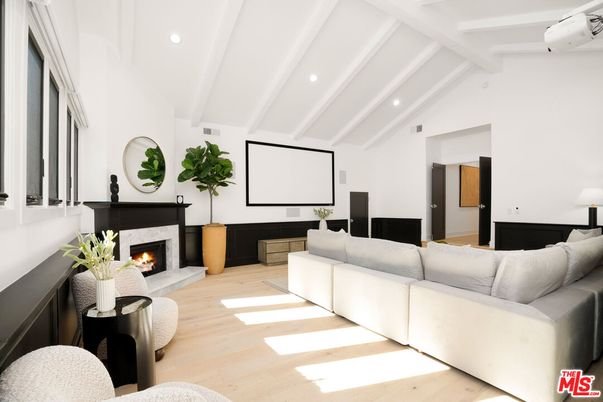 Fireplace, Interior, Living room, Projection Screen, Recessed Lighting, Wood Texture Flooring
