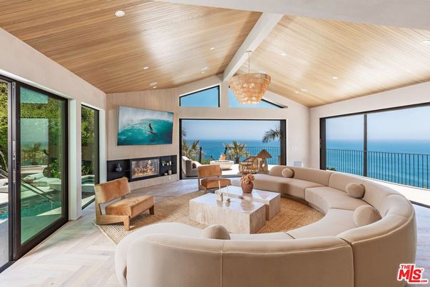 Chandelier, Fireplace, Interior, Living room, Pendant Lights, Recessed Lighting, Water, Wooden Ceilings, Wood Texture Flooring