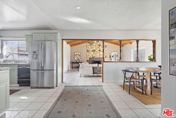 Dining room, Fireplace, Interior, Kitchen, Living room, Recessed Lighting, Stainless Steel Appliances, Stone Walls, Wooden Beams